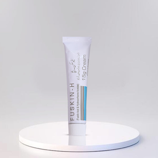 Fuskin-H cream tube (15g) on a white pedestal against a gray background.